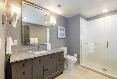 a bathroom with a toilet and a sink and a shower at WorldMark Kingstown Reef - 2BD Sleeps up to 6 in Orlando