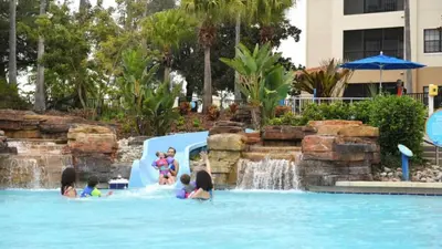 a group of children playing in a water park at Near Disney 1BD vacation condo in beautiful resort with lots of amenities in Orlando