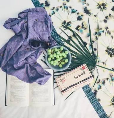 a book and a bowl of fruit on a table at Enjoy Orlando Family Getaway in 2BD condo with lots of onsite activities in Orlando