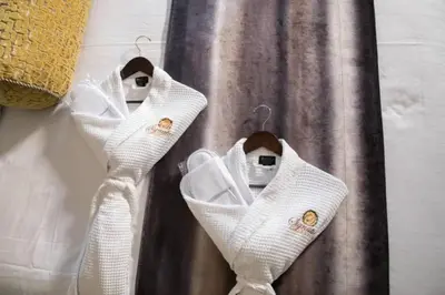 three white wedding shoes hanging on a curtain at Enjoy Orlando Family Getaway in 2BD condo with lots of onsite activities in Orlando