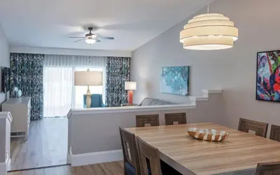 a dining room with a wooden table and a dining room at Enjoy Orlando Family Getaway in 2BD condo with lots of onsite activities in Orlando