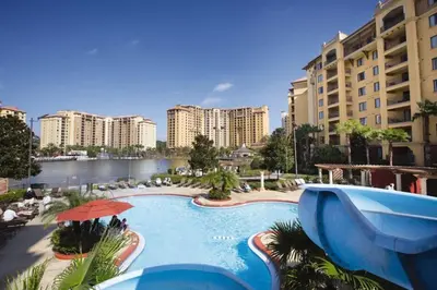 a large swimming pool in a resort with buildings at Beautiful Resort in Bonnet Creek 1BD Deluxe near Walt Disney World in Orlando
