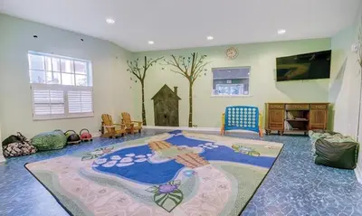 a living room with a large rug on the floor at Beautiful Hotel of Cypress Palms 1BD near Kissimmee Lakefornt Park in Kissimmee