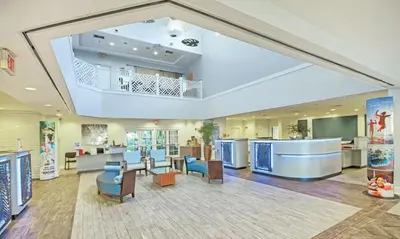 a lobby of a hospital with a large ceiling at Beautiful Hotel of Cypress Palms 1BD near Kissimmee Lakefornt Park in Kissimmee