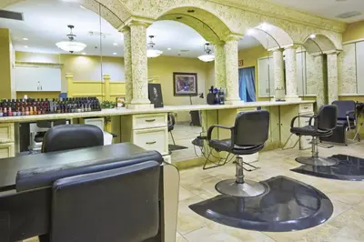 a salon with chairs and tables in a room at Beautiful Resort in Star Island 2BD near at Lake Cecile in Kissimmee