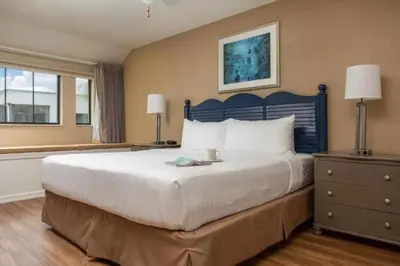 a bedroom with a large bed and a window at Diamond - Orbit One Vacation Villas- 2BD in Orlando