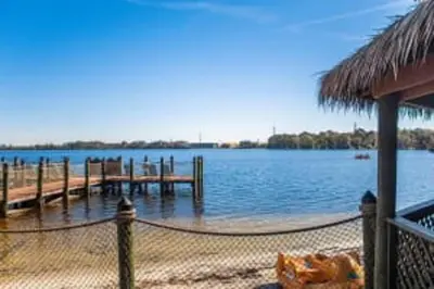 a dock on a body of water at Diamond Bryans Spanish Cove 2BD in Orlando