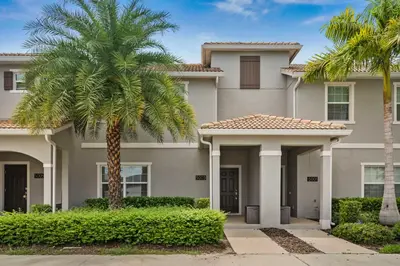 a house with palm trees in front of it at 5003 Windermere Avenue in Kissimmee