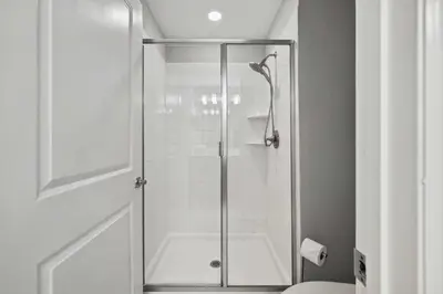 a shower with a glass door in a bathroom at 5003 Windermere Avenue in Kissimmee