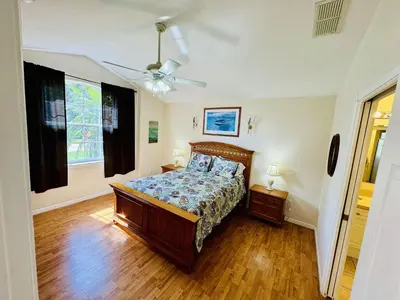 a bedroom with a bed and a ceiling fan at 43 Vacation Home With Private Pool Located At Formosa Gardens!! in Orlando