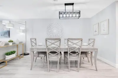 a dining room with a table and chairs at Stylish Villa Near Disney & Universal in Kissimmee