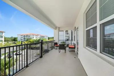 a balcony with a view of a street at Modern Resort 2BR near Icon park, Convention center and NEW Epic Universe in Orlando