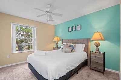 a bedroom with a bed and a window at Terra Verde Townhouse with Patio in Kissimmee