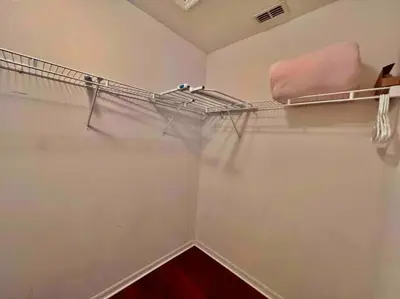 a room with a closet with at 7BD 5BA w Pool Spa Home 10 mins away to Disney in Kissimmee