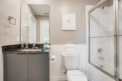 a bathroom with a toilet and a sink and a shower at Luxury Villa Near Disney and Universal in Kissimmee