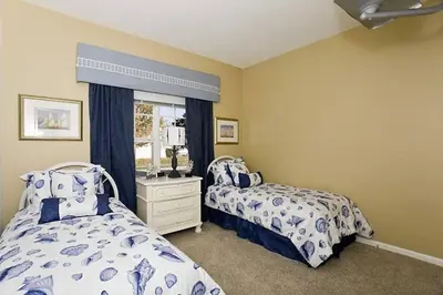 a bedroom with two beds and a window at Just 3 miles from Disney! in Kissimmee