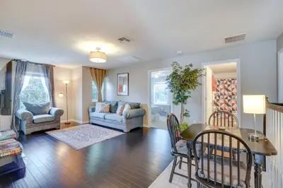 a living room with a couch and a table and chairs at WFH, Relax and Enjoy At-Home Comforts in Orlando in Kissimmee