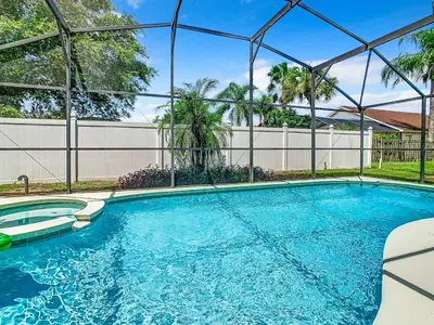 a swimming pool with a clear blue water at Dreamy 5BR, 3Bath Getaway, Pool, Spa, Near Disney in Orlando