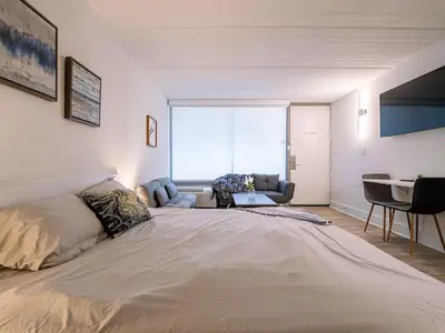 a large bed in a room with a large window at Orlando 1BR Relaxing Condo Next to Disney With Pool view in Kissimmee