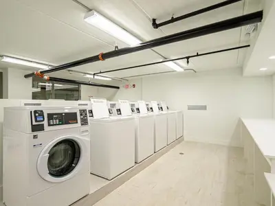 a laundry room with a washer and dryer at Orlando 1BR Relaxing Condo Next to Disney With Pool view in Kissimmee