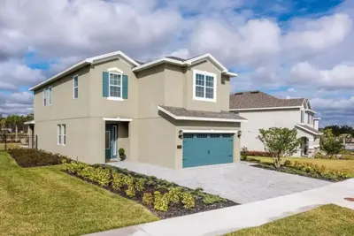 a large house with a garage at 7738-IBRHAIM · 7738 Fairfax Dream Home in Orlando