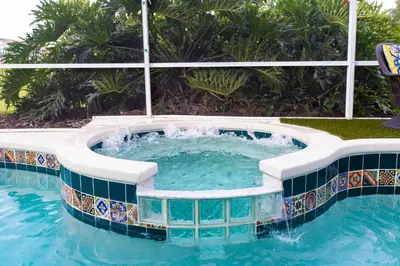 a swimming pool with a jacuzzi in a resort at Celebrate BR in Orlando