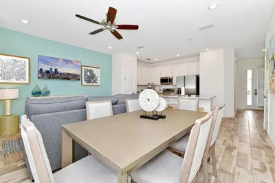 a dining room and kitchen with a table and chairs at Lovely Villa Cottage Near Disney With Margaritaville Resort & Island H20 Waterpark Access - 2931Cl in Orlando