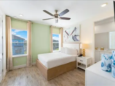 a bedroom with a bed and a ceiling fan at Beautiful Florida Villa Near Disney With Margaritaville Resort & Island H20 Waterpark Access - 2939Cl in Orlando