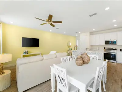 a living room with a white couch and a table at Beautiful Florida Villa Near Disney With Margaritaville Resort & Island H20 Waterpark Access - 2939Cl in Orlando