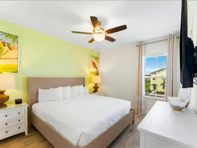 a bedroom with a bed and a ceiling fan at Beautiful Florida Villa Near Disney With Margaritaville Resort & Island H20 Waterpark Access - 2939Cl in Orlando