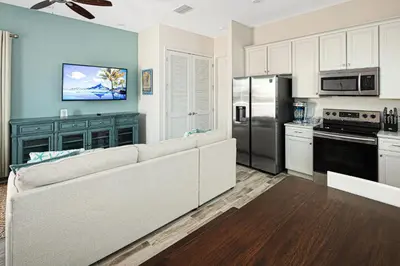 a living room with a couch in a kitchen at Sea Shell Blue Cottage Near Disney With Private Pool And Margaritaville Resort & Island H2O Access - 8039Kd in Orlando