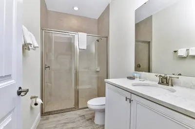 a bathroom with a shower and a toilet and a sink at Blissful Pink Villa Near Disney With Margaritaville Resort & Island H20 Access - 8103Cp in Orlando