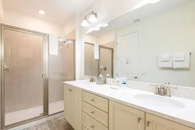 a bathroom with a sink and a shower at Vibrant Cottage With Private Pool Near Disney With Margaritaville Resort & Island H2O Access - 8043Kd in Orlando