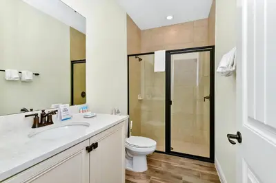 a bathroom with a toilet and a sink and a shower at Tangerine Villa Near Disney With Margaritaville Resort And Island H20 Waterpark Access - 8178Cp in Orlando