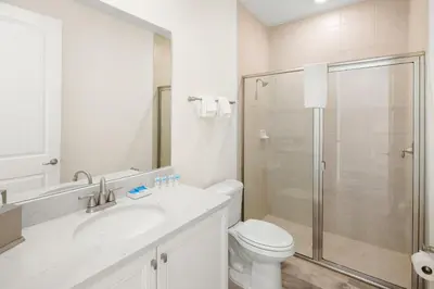 a bathroom with a shower and a toilet and a sink at Lime Green Villa Near Disney With Margaritaville Resort & Island H20 Waterpark Access - 2944Or in Orlando