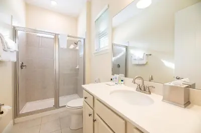 a bathroom with a shower and a sink and a toilet at Shore To Please Cottage Near Disney With Margaritaville Resort & Island H2O Access - 3044Sp in Orlando