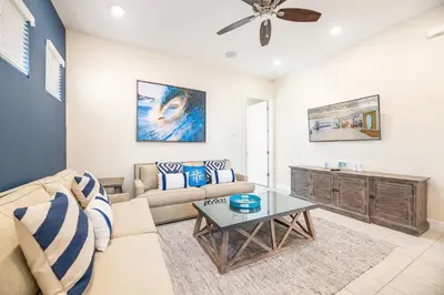 a living room with a couch and a table at Shore To Please Cottage Near Disney With Margaritaville Resort & Island H2O Access - 3044Sp in Orlando
