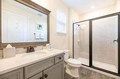a bathroom with a sink and a toilet and a shower at Spectacular Cottage With Private Pool Near Disney With Margaritaville Resort & Island H2O Access - 8026Kd in Orlando
