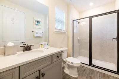 a bathroom with a sink and a toilet and a shower at Spectacular Cottage With Private Pool Near Disney With Margaritaville Resort & Island H2O Access - 8026Kd in Orlando