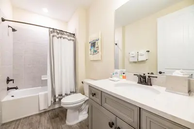 a bathroom with a sink and a toilet and a shower at Spectacular Cottage With Private Pool Near Disney With Margaritaville Resort & Island H2O Access - 8026Kd in Orlando