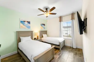 a bedroom with two beds and a ceiling fan at Orange Bliss Villa Near Disney With Margaritaville Resort & Island H20 Waterpark Access - 2955Cl in Kissimmee