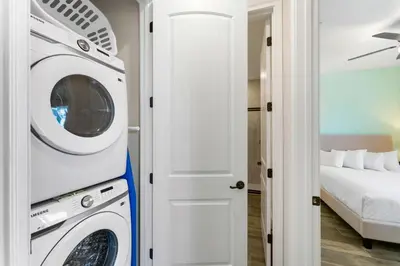 a laundry room with a washer and dryer at Orange Bliss Villa Near Disney With Margaritaville Resort & Island H20 Waterpark Access - 2955Cl in Kissimmee