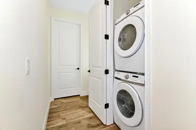a laundry room with a washer and dryer at Colorful Villa Near Disney With Margaritaville Resort & Island H20 Waterpark Access - 3140Cs in Orlando