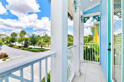 a balcony with a view of a street at Orange Blossom Special Cottage Near Disney With Private Hot Tub & Island H20 Waterpark Access - 3071Pi in Orlando