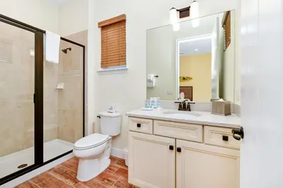 a bathroom with a toilet and a sink and a shower at Pina Cabana Cottage Near Disney With Margaritaville Resort & Island H2O Access - 3070Kl in Orlando