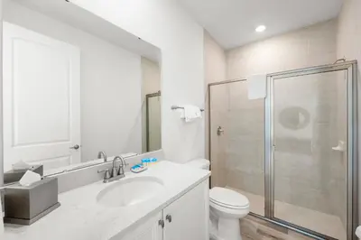 a bathroom with a toilet and a sink and a shower at Lime Green Villa Near Disney With Margaritaville Resort & Island H20 Waterpark Access - 2965Cs in Orlando