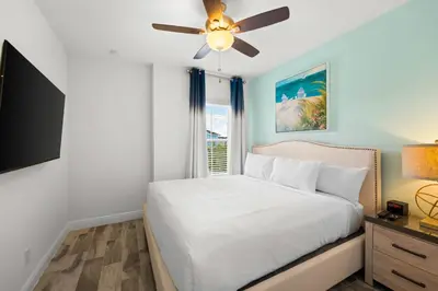 a bedroom with a bed and a ceiling fan at Lime Green Villa Near Disney With Margaritaville Resort & Island H20 Waterpark Access - 2965Cs in Orlando