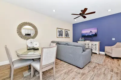a living room with a couch and a table at Welcoming Villa Near Disney With Margaritaville Resort & Island H20 Waterpark Access - 2943Cl in Orlando