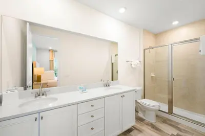 a bathroom with a sink and a shower and a toilet at Caribbean Dream Villa Near Disney With Margaritaville Resort & Island H20 Waterpark Access - 2980Or in Orlando