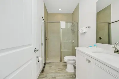 a bathroom with a shower and a toilet and a sink at Beautiful Waterfront Villa Near Disney With Margaritaville Resort & Island H20 Waterpark Access - 3017Cs in Orlando